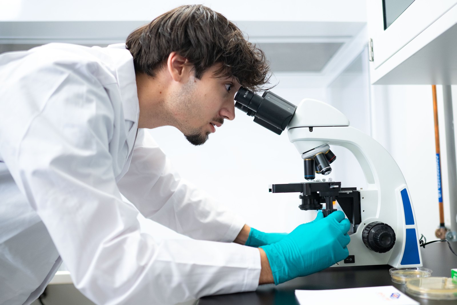Laboratory researcher looking through a microscope