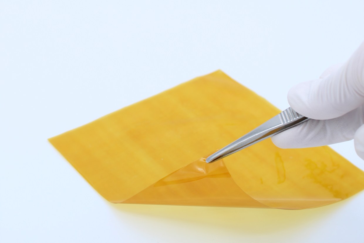 The film peeled back from the surface with forceps
